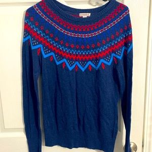 Small sweater. Even thought it’s small, it can fit a medium sized person